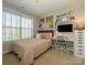 Cozy bedroom with natural light, stylish decor, and a comfortable bed at 151 E Morehouse Ave, Mooresville, NC 28117