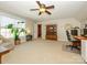 Spacious bedroom featuring a ceiling fan, neutral carpet, and ample natural light at 151 E Morehouse Ave, Mooresville, NC 28117