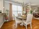 Cozy dining area with natural light, hardwood floors, and access to the living room at 151 E Morehouse Ave, Mooresville, NC 28117