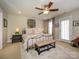 Spacious main bedroom with neutral decor, ceiling fan, and ample natural light at 151 E Morehouse Ave, Mooresville, NC 28117