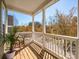 A cozy porch with a wicker chair offers scenic views and a relaxing space at 151 E Morehouse Ave, Mooresville, NC 28117