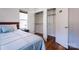 Bedroom view with a large closet with a wire shelf, window and hard wood floors at 1621 Keeling Pl, Charlotte, NC 28210