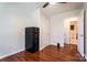 Bedroom featuring wood floors, ceiling fan, and a closet with an adjacent bathroom at 1621 Keeling Pl, Charlotte, NC 28210