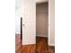 Open closet with wire shelving and hardwood floors at 1621 Keeling Pl, Charlotte, NC 28210