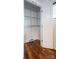 Walk-in closet with wire shelving and hardwood flooring for organized storage at 1621 Keeling Pl, Charlotte, NC 28210