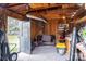 Interior view of a storage shed featuring wood walls and lighting at 1621 Keeling Pl, Charlotte, NC 28210