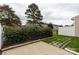 Fenced backyard with greenery and a concrete and paver patio at 187 Snead Rd, Fort Mill, SC 29715