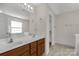 Main bathroom with double sink, and large mirror at 187 Snead Rd, Fort Mill, SC 29715