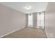 Neutral bedroom featuring large windows and light-colored walls at 187 Snead Rd, Fort Mill, SC 29715