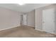 Neutral bedroom featuring three doors, carpet and light-colored walls at 187 Snead Rd, Fort Mill, SC 29715