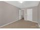 Neutral bedroom featuring two doors, carpet and light-colored walls at 187 Snead Rd, Fort Mill, SC 29715