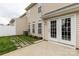 Exterior view of the home with a paved backyard and double doors at 187 Snead Rd, Fort Mill, SC 29715