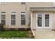 Exterior view of the home with a paved backyard and double doors at 187 Snead Rd, Fort Mill, SC 29715