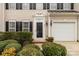 Close-up of townhome entrance featuring decorative door, sidelights, and manicured shrubs at 187 Snead Rd, Fort Mill, SC 29715