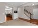 Inviting living room with view of kitchen, staircase, and hardwood flooring at 187 Snead Rd, Fort Mill, SC 29715