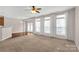 A spacious living room featuring a large window and carpeted floors at 187 Snead Rd, Fort Mill, SC 29715