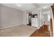 Cozy living room with neutral carpet, hardwood flooring, and easy access to the kitchen at 187 Snead Rd, Fort Mill, SC 29715