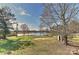 Expansive backyard featuring lake views, mature trees, and lots of green space at 2013 Barkley Cir, Monroe, NC 28112