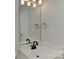 Clean bathroom vanity with white sink, black faucet, and a bright mirror at 2013 Barkley Cir, Monroe, NC 28112