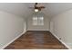 A spacious bedroom with hardwood floors and a ceiling fan at 2013 Barkley Cir, Monroe, NC 28112