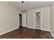 This cozy bedroom features gleaming hardwood floors and convenient access to the adjacent bathroom at 2013 Barkley Cir, Monroe, NC 28112