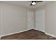 Bedroom featuring hardwood floors, ceiling fan, and neutral walls with white doors at 2013 Barkley Cir, Monroe, NC 28112