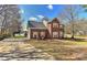 Beautiful brick home with attached garage and mature trees, offering curb appeal at 2013 Barkley Cir, Monroe, NC 28112