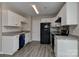 Modern kitchen with sleek appliances, white cabinets, and gray counter tops at 2013 Barkley Cir, Monroe, NC 28112