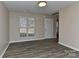 Inviting living room filled with natural light, featuring neutral walls, and a large window at 2013 Barkley Cir, Monroe, NC 28112