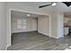 Open-concept living area with luxury vinyl plank flooring, neutral paint and a door leading to the kitchen at 2013 Barkley Cir, Monroe, NC 28112