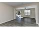 Living room featuring natural lighting, neutral paint, and LVP flooring at 2013 Barkley Cir, Monroe, NC 28112