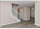 Living room showcasing staircase with gray flooring, white risers, and white railing at 2013 Barkley Cir, Monroe, NC 28112