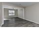 Spacious room featuring new flooring and a ceiling fan, providing a comfortable atmosphere at 2013 Barkley Cir, Monroe, NC 28112