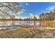 Scenic view of a tranquil pond surrounded by trees and open space at 2013 Barkley Cir, Monroe, NC 28112