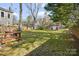 Picturesque backyard featuring a shed, and plenty of green space surrounded by mature trees and fencing at 2309 Shenandoah Ave, Charlotte, NC 28205