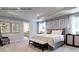 Serene main bedroom featuring tray ceilings, plush carpeting, and an en-suite bathroom at 3014 Bramble Hedge Rd # 3270, Indian Trail, NC 28079