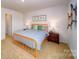 Comfortable bedroom featuring carpeted floors and a vibrant orange bed frame at 3021 Sassafras Trl, Gastonia, NC 28056