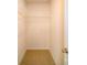 Empty closet with beige carpet and white shelves at 3021 Sassafras Trl, Gastonia, NC 28056