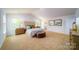 Bedroom featuring neutral paint, vaulted ceiling, plush carpet, natural light, and neutral decor at 3021 Sassafras Trl, Gastonia, NC 28056