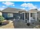 Spacious backyard featuring a covered pergola with outdoor seating and lush landscaping at 3097 Arches Bluff Cir, Lancaster, SC 29720