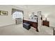 Bedroom with plush carpet, decorative valance over the window, and stylish furniture at 3097 Arches Bluff Cir, Lancaster, SC 29720