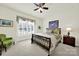 Well-lit bedroom with carpet, a ceiling fan and a window with a valance at 3097 Arches Bluff Cir, Lancaster, SC 29720