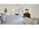 Large bedroom with neutral walls, a bed, and an ensuite bathroom that is well lit at 3097 Arches Bluff Cir, Lancaster, SC 29720