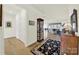 Inviting entryway showcasing hardwood floors, complemented by an elegant rug and a display case at 3097 Arches Bluff Cir, Lancaster, SC 29720