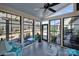 Enclosed sunroom with black framed windows overlooking the exterior community at 3097 Arches Bluff Cir, Lancaster, SC 29720