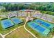 Aerial view of community tennis courts and clubhouse with parking at 3097 Arches Bluff Cir, Lancaster, SC 29720