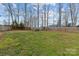 Expansive backyard enclosed by a tall wooden privacy fence at 3919 Chatterleigh Dr, Monroe, NC 28110