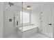 Bathroom with large tub, shower and neutral colors at 3919 Chatterleigh Dr, Monroe, NC 28110