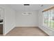 Bright dining room with modern light fixture and large window at 3919 Chatterleigh Dr, Monroe, NC 28110