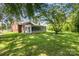 Expansive backyard featuring lush greenery and mature trees, perfect for outdoor activities and relaxation at 404 E 1St St, Cherryville, NC 28021